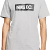 Nike Men's F.C. Soccer Graphic T-Shirt 1 Nike Men's F.C. Soccer Graphic T-Shirt -Ball Games Comprehensive Shop 20NIKMMNKFCSSTXXXNST Dk Grey Heather