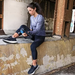 Therabody - Theragun PRO Smart Percussive Therapy Device -Ball Games Comprehensive Shop Theragun PRO Female Running PDP